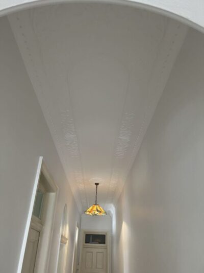 Hallway ceiling repair and painting with smooth finish in Sydney home